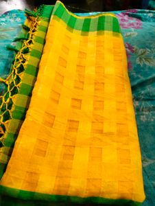 Yellow Saree  Green Blouse.