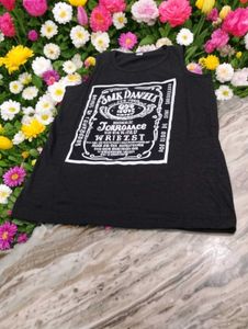 This black sleeveless t-shirt features a bold whit