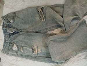 damaged jeans .