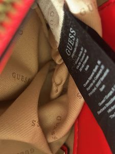 guess hand bag in red colour