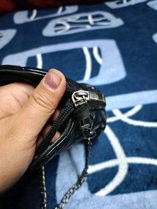 Black Quilted Carrot Sling Bag