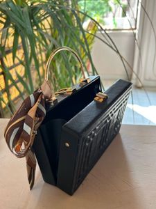 Structured Black Sling Bag with Golden Straps