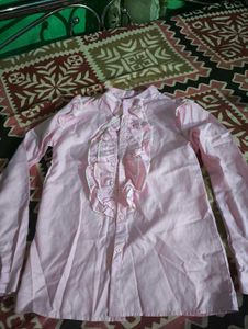pink ruffle shirt