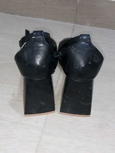 Strappy front open 3 inch black heels.