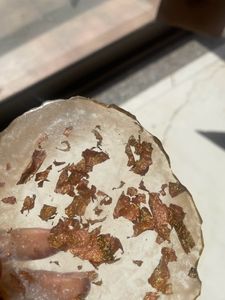 resin coaster with gold flakes in it