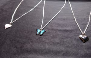 White Heart, Blue Butterfly &amp; Black Heart Locket