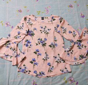 Cute pink bell-sleeve top!