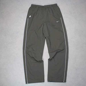 NIKE PARACHUTE BAGGY TRACKS.