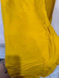 Mustard churidar pant.