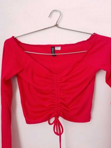 branded red long sleeves crop top.