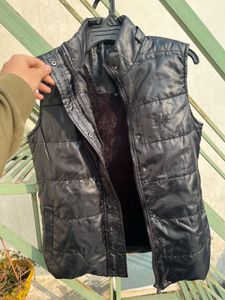 Almost brand new sleeveless black jacket