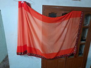 Classicate Orange Embroidered Chiffon Saree