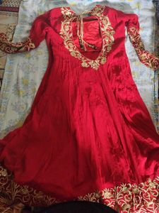 a good conditioned red embroidered gown or frock s