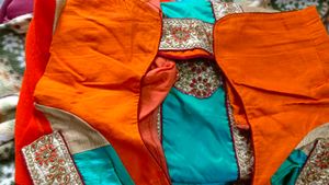 Orange Saree With Turquoise And GoldenBorder