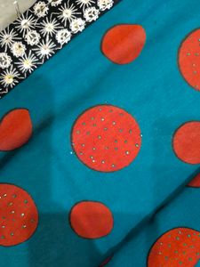 Green,red,black and white standard saree.