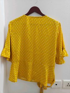 Harpa Yellow polka wrap top