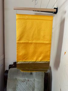 Elegant Yellow Art Silk Saree With A Classy Bangle