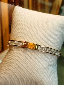 MICHAEL KORS GOLD PLATED WRISTWEAR