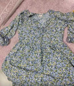 A Blue Ruffled Dress