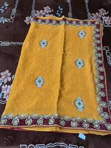 heavy work yellow red velvet border saree with blo