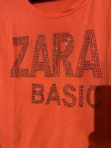 Soft Fabric,Cute Orange Bold Colour Top With Topography Print,medium In Size Bust Size -32, Can Pair It With Black Pant Or Dark Blue Jeans