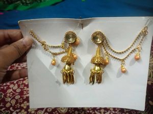 Gold toned Jhumka Earrings with Hair Chain