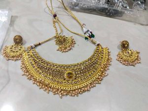 Golden Colour Choker With Earring Pair And Tika
