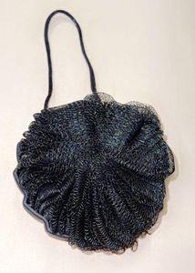 A two-sided bath puff Or Loofah