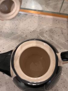 ceramic tea cup and kettle