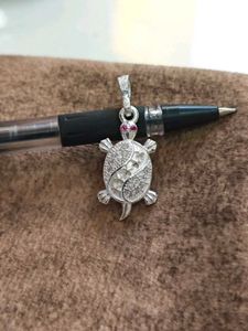 Turtle design locket with pink stone