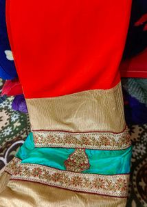 Orange Saree With Turquoise And GoldenBorder