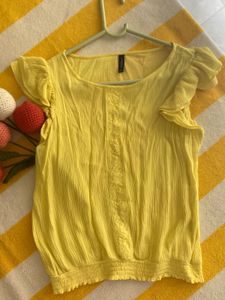 yellow color top with cute flowy hand frill