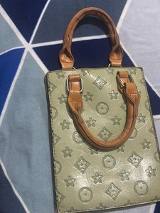 Louie’s Vitton patterned mini handbag