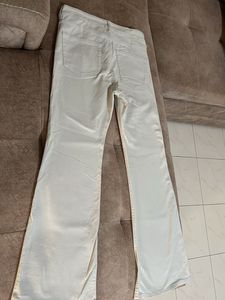 Cream bootcut Jeans