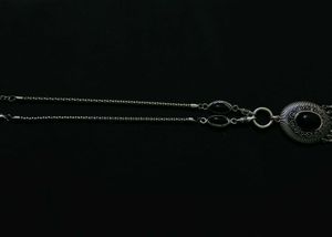 A Black Necklace along With White One
