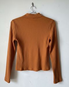 mustard brown top