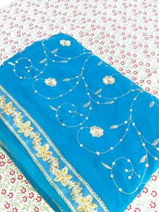 ✨ Teal Blue Saree with Golden Floral Elegance ✨