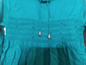 Turquoise Green Peplum Top With Pearl Design