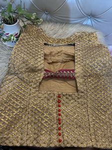 Backless golden choli