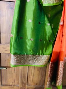 orange colour silk saree with green mundani