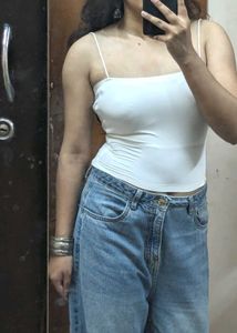 Pair Of White Sleeveless Tops