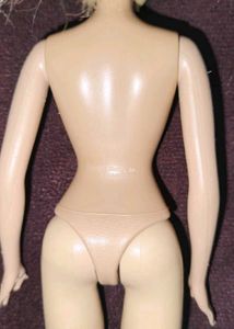 Two used barbie dolls