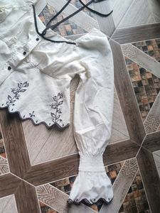 Embroidered Peplum Top