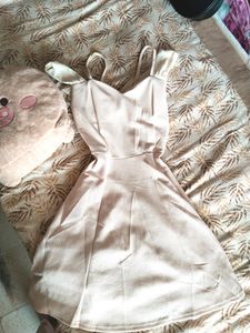 Light Pink Coloured One Piece With Bow Design At Back