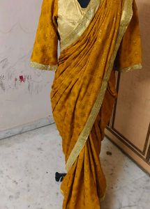 Elegant Mustard Saree with Gold Border