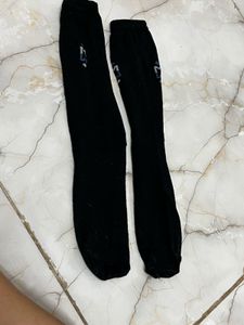 One Pair Of Worn Black Socks