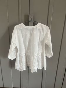 White Embroidered Peplum Top