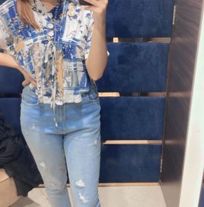 A Crop Top With Floral Design