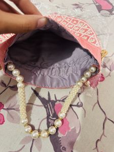 Regal Pink Pearl Potli Bag with Embellished Handle