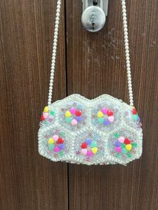 A Sling Bag With Pearls